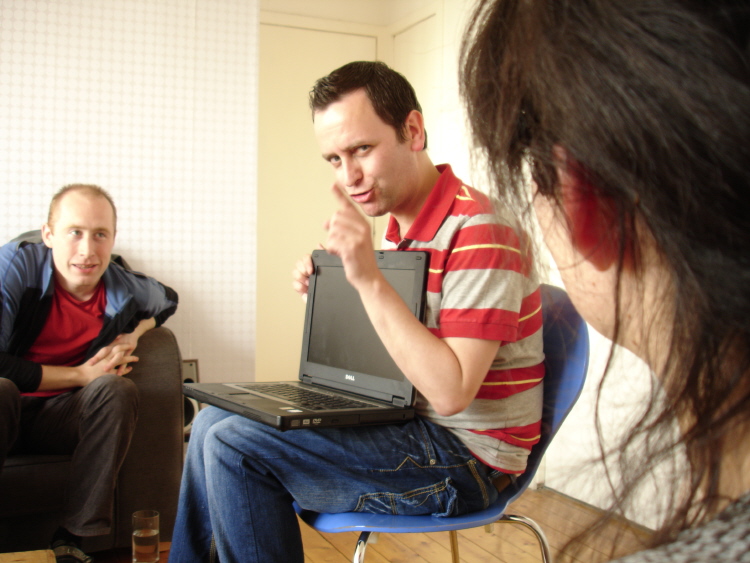 Home Hindrance - Paul Hickey in the living room as Eammon, with two audience members (photo: David Leddy) 
